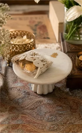Rakhi + Marble Mogra Pedestal +
Hershey Kisses